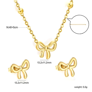 Parure bijoux nœud doré avec collier à perles et boucles d'oreilles assorties