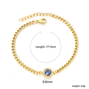 Detail view of gold curb chain bracelet with blue zircon pendant and lobster clasp
