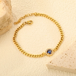Gold stainless steel bracelet with a large blue zircon pendant and white diamond halo