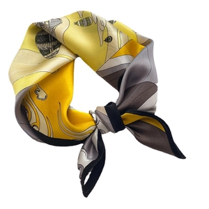 Elegant silk square scarf featuring hot air balloon prints in yellow and grey tones