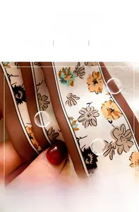 Close-up of silk floral scarf showing fine inner stitching and soft printed fabric