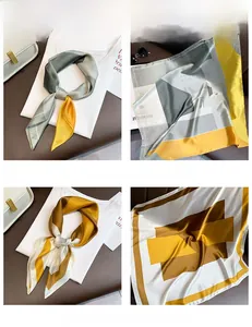 Detail of silk satin neckerchief featuring geometric color block pattern in vibrant shades