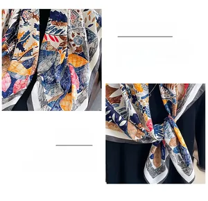 Detail of fine edge stitching on natural leaf print silk scarf with vintage floral patterns