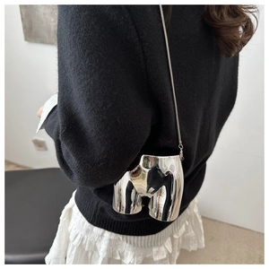 Silver mirror-finish art handbag with unique body-shaped design and metal chain strap