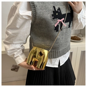 Artistic gold mirror body-shaped crossbody bag with fine metal chain strap on model