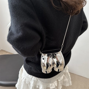 Creative silver mirror butt-shaped crossbody bag with metal chain strap on model
