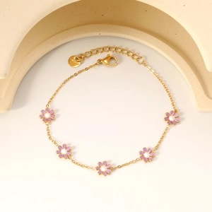 Golden stainless steel daisy bracelet featuring five purple enamel flowers and adjustable chain