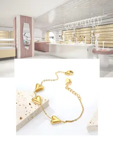 Detail of 18K gold plated heart bracelet with lobster clasp and adjustable steel chain