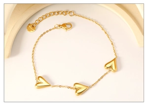 Close-up of 18K gold-plated stainless steel heart bracelet with adjustable chain and lobster clasp