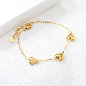 Polished 18K gold plated stainless steel bracelet with three 3D heart pendants