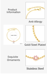 Detail of golden stainless steel beaded bracelet with purple flower charm and lobster clasp