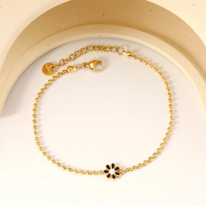 Gold stainless steel beaded bracelet with black and white daisy flower charm for women