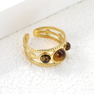Bohemian gold-tone open ring featuring three round tiger eye stones and woven texture