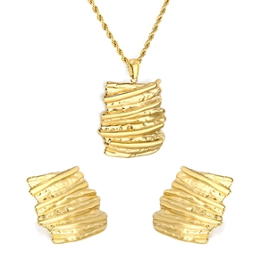 Golden jewelry set featuring irregular lava texture pendant necklace and matching stud earrings