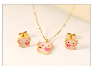 Close-up of cute pink axolotl necklace and earrings set with red heart detail