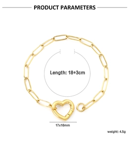 Close-up of 18K gold-plated paperclip chain bracelet with a heart-shaped spring clasp