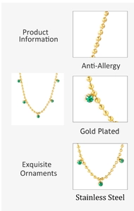 Detail of gold plated stainless steel bead chain with emerald green zircon pendant