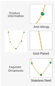 Detail view of gold plated stainless steel necklace with anti-allergy green heart gem