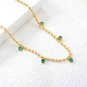 Minimalist 18K gold stainless steel bead necklace with five round emerald green crystals