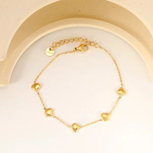 Minimalist 18K gold stainless steel bracelet featuring five delicate scallop shell charms