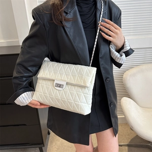 Quilted white shoulder bag with geometric stitching and silver chain strap for women