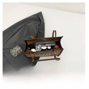 Spacious leopard print tote bag interior view showing cosmetics and daily essentials