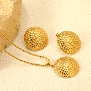 Elegant 18K gold-plated jewelry set with textured dome necklace and matching earrings
