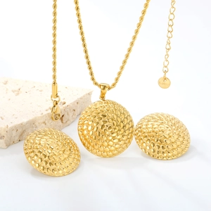 Golden 18K stainless steel jewelry set with textured circular pendants and earrings