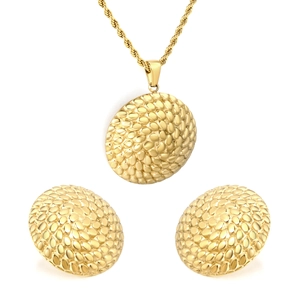 Golden jewelry set featuring round textured earrings and matching dome pendant necklace
