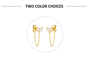 Detailed close-up of gold leaf-shaped zircon earrings with long fringe tassel chains
