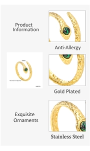 Macro detail of gold-plated snake ring featuring emerald zircon and size dimensions