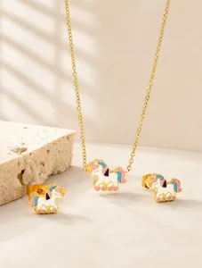 Detailed view of unicorn jewelry set with colorful enamel necklace and stud earrings