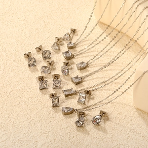 Silver stainless steel jewelry set featuring various geometric zircon earrings and necklaces