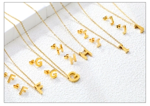 Detail showing gold-plated letter pendants F to J with matching stud earrings set