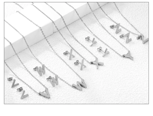 Silver stainless steel jewelry set featuring alphabet pendants and matching stud earrings