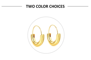 Detail of chunky gold U-shaped hoop earrings featuring a high-polish mirror finish surface