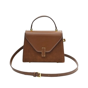 Brown leather Kelly bag with contrast matte suede panels and gold-tone buckle hardware