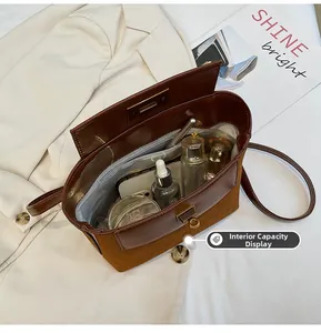 Detail showing internal capacity of the vintage leather handbag with multiple compartments