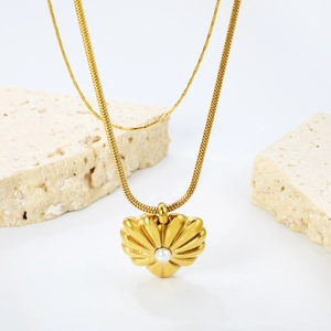 French vintage gold snake chain necklace with a pearl heart shell pendant on stone decor