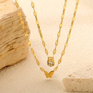 Double-layered gold stainless steel necklace with round crystal and butterfly pendant