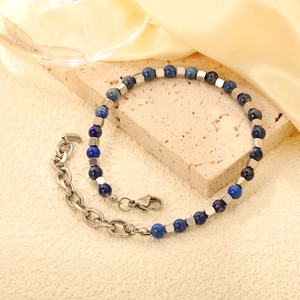 Detail view of blue stone beaded bracelet with silver spacers and adjustable lobster clasp