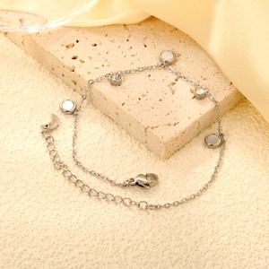 Elegant stainless steel heart bracelet with mother of pearl and zircon charms on stone