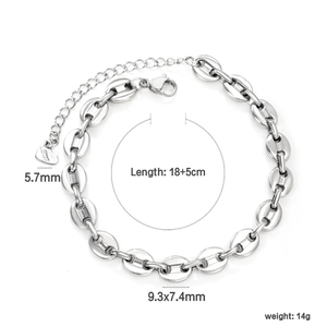 Silver stainless steel coffee bean link bracelet with heart pendant on white background