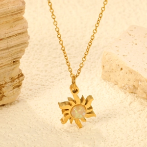 Detailed view of a gold sun flower pendant with an opal stone on a fine metal chain