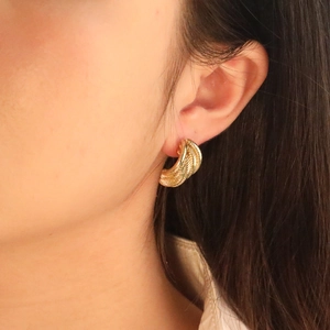 Golden twisted rope hoop earrings in minimalist semi-circle style for women