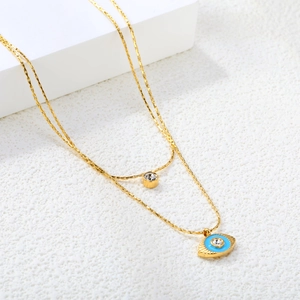 Double-layered gold stainless steel necklace with blue evil eye and zircon pendants