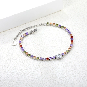 Rainbow cubic zirconia tennis bracelet with heart centerpiece and moon charm on silver chain