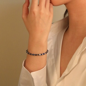 Minimalist beaded bracelet with natural blue lapis stone and grey metallic cube beads
