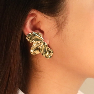 Exaggerated golden stainless steel earrings with artistic irregular folded petal design