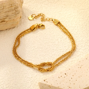 Bracelet élégant en acier inoxydable plaqué or 18 carats à triple chaîne avec nœud